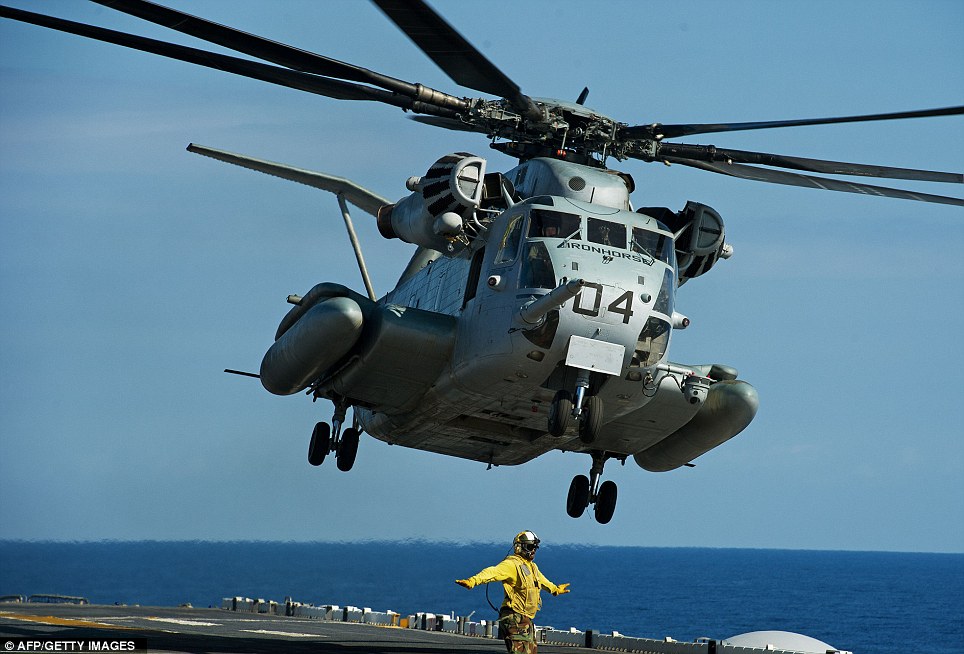 Military: A Sikorsky Super Stallion Iron Horse helicopter takes off from the USS Wasp as eight countries took part in the largest amphibious assault for a decade